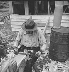 a wpa laborer making shingles for a cabin