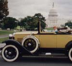 an antique car in front of the capital