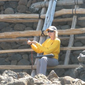 Park archeologist with the Earthquake Repair Project working on Mailekini Heiau (Sept. 2009).