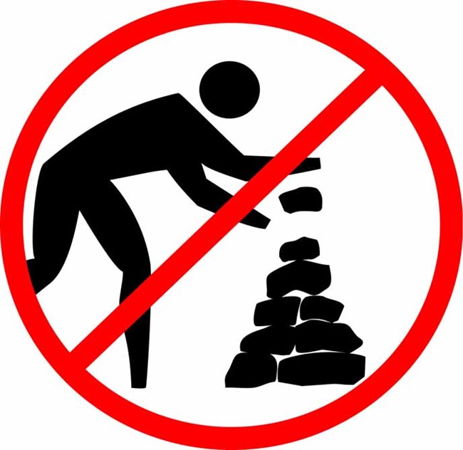Icon showing person stacking rocks with a red "no" symbol over it.