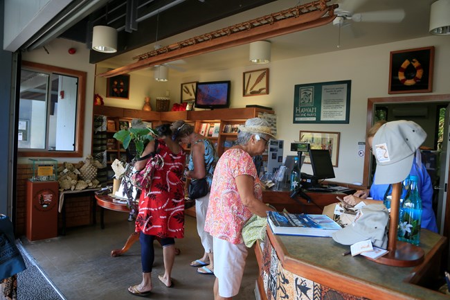 Visitors shop in the Puʻuhonua o Hōnaunau NHP bookstore