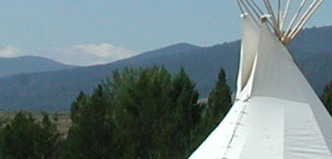 tipi smoke flaps and sky, tipi is put up each day during the summer months