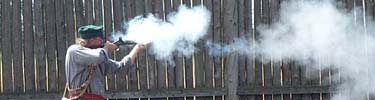 Park ranger Bill DeBerry fires during a recent black powder program
