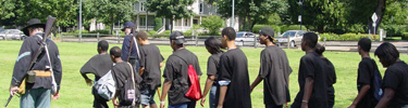 Students participate in a program in the park