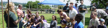 A student presents a program to the public at the annual Brigade Encampment special event