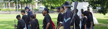 Students marching with Park Rangers at a special event