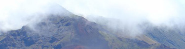 Clouds rapidly covering the summit of the mountain.