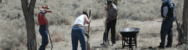 Volunteer work on archeological cleanup. NPS Photo.