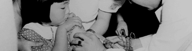 Child receives immunization. Photo courtesy of National Archive.