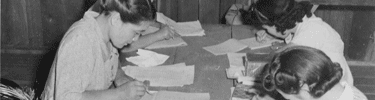 Adult Education class studies American Citizenship and English. Photo by Dorothea Lange.