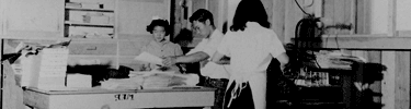 Manzanar Free Press, the local newspaper, was delivered free to internees. Photo by Dorothea Lange.
