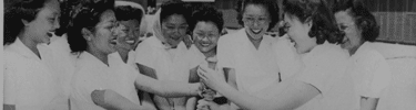 Members of the Chick-a-dee softball team choose sides for a practice game. Photo courtesy of the National Archive.