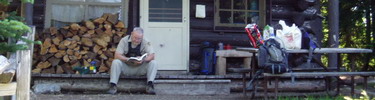A volunteer waits for visitors at a backcountry patrol cabin in Mount Rainier National Park