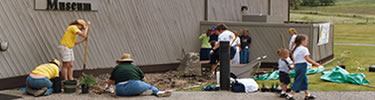 Volunteers planting native shrubs at Spalding visitor center