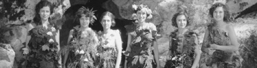 Employees of the Chateau during 1930s of women wearing grass and flowers, perhaps cavewomen of the Cavemen.