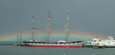 BALCLUTHA at Hyde Street Pier after a rainstorm passed through and left behind a rainbow.