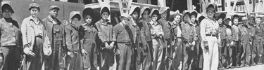 WWII Shipyard workers with woman foreman.