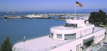 The Aquatic Park Bathhouse Building and a view of Aquatic Park and the Hyde Street Pier.