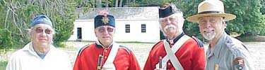 re-enactors join a park ranger at English Camp.