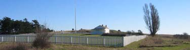 The officers' quarters and parade ground fence at American Camp.