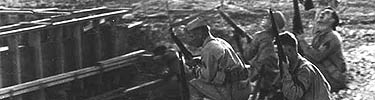 Marines armed with Springfield 03 rifles take up positions at Ewa Marine Corps Air Station.