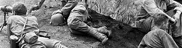 Forward observers of the 77th Division, U.S. Army, keep a constant watch over the progress of the troops on Guam