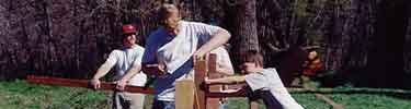 Boy scouts building fence