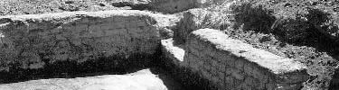 Adobe wall of Whitmans' first house, exposed during archeological dig.