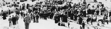 people walking up the hill at the 50th Anniversary commemoration of the Whitmans' deaths