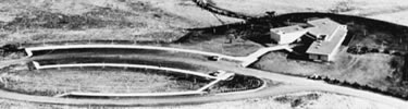 historic photo circa 1963: ariel view of new visitor center and circular parking area
