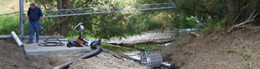 Pump system on Doan Creek with suction section floating on top of water.