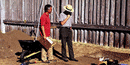 Image of a ranger examining an excavation site
