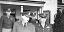 Eisenhower walking out of Fort Mason headquarters building