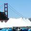 Picture of the Avon Breast Cancer Walk-a-Thon setup at Crissy Field with the Golden Gate Bridge in the background.