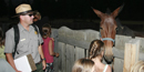 Ranger Andy and some kids with a mule