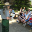 visitors and park ranger learn about the park