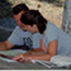 a couple works on plans for the Visitor Center