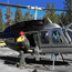 A firefighter loads ignition balls into waiting helicopter
