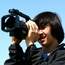 Kid holding film camera