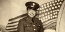 Sadao Munemori with American flag.
