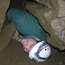 Squeezing through the rocks during Oregon Caves Off-Trail Caving Tour