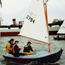 Sailors aboard a Pelican sailboat.
