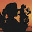 A woman takes a sight using a sextant.