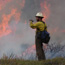Firefighter in front of a blaze