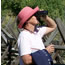 woman looking for birds with binoculars