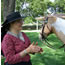 Woman in period clothing with horse