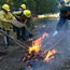 People setting a fire