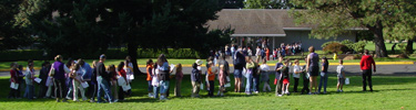 School children enjoy a program led by on of the site's many Volunteers-in-Parks