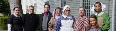 Image of volunteers in period clothing