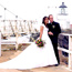 A couple poses in front of Point Bonita lighthouse.